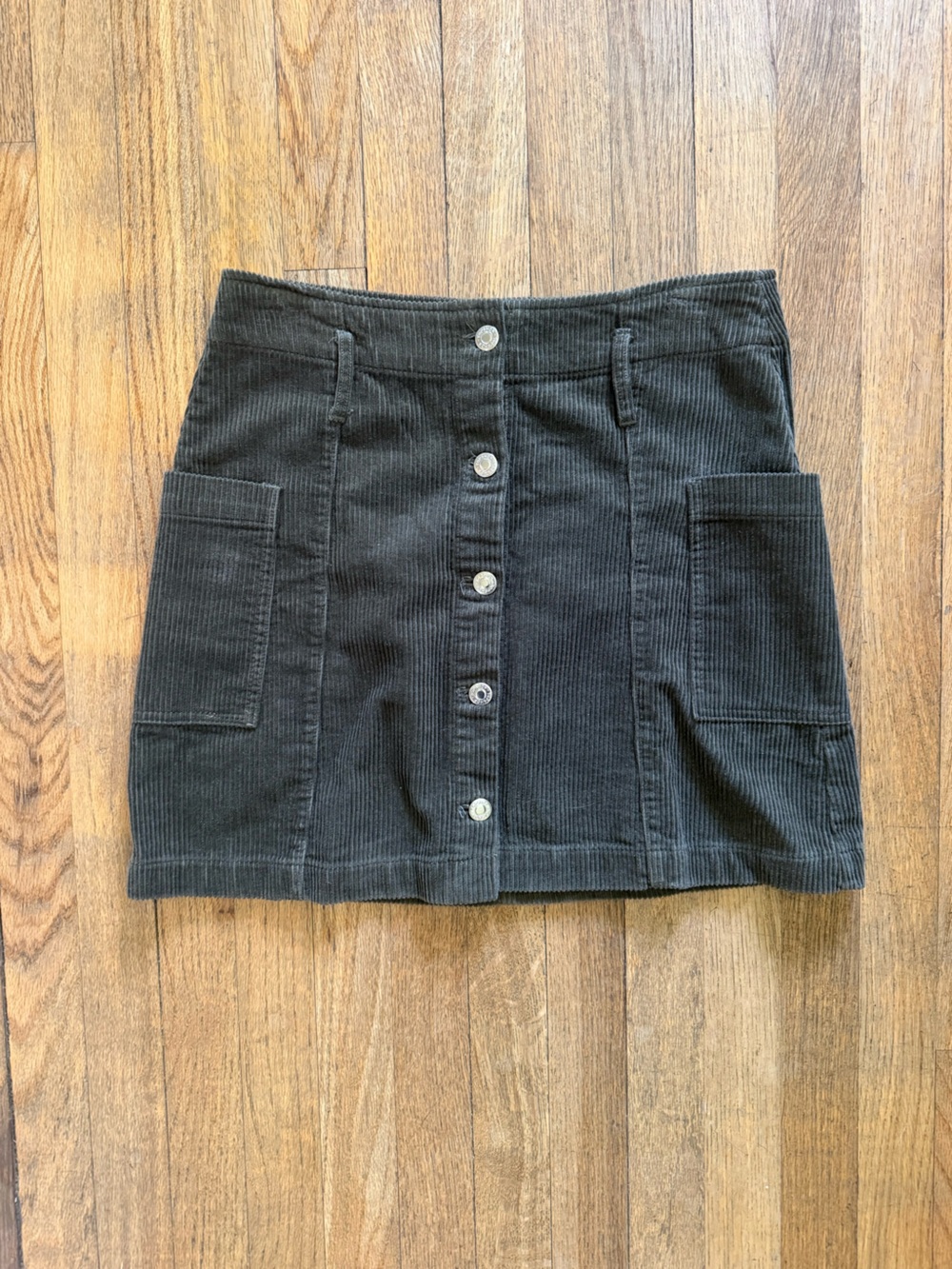 Topshop dark green corduroy mini skirt with button up front, size 6